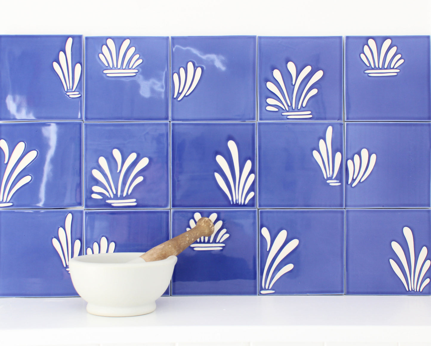 Spray hand painted tiles in Ocean