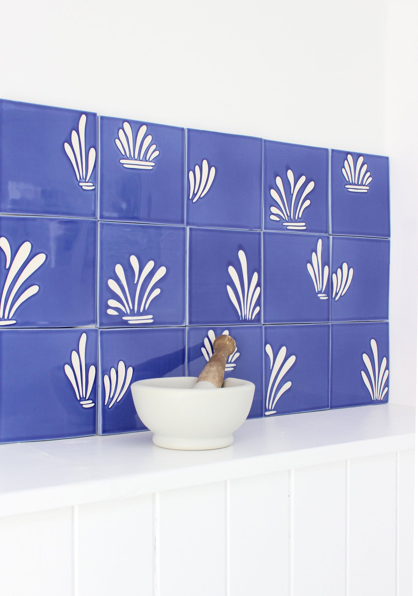 Spray hand painted tiles in Ocean