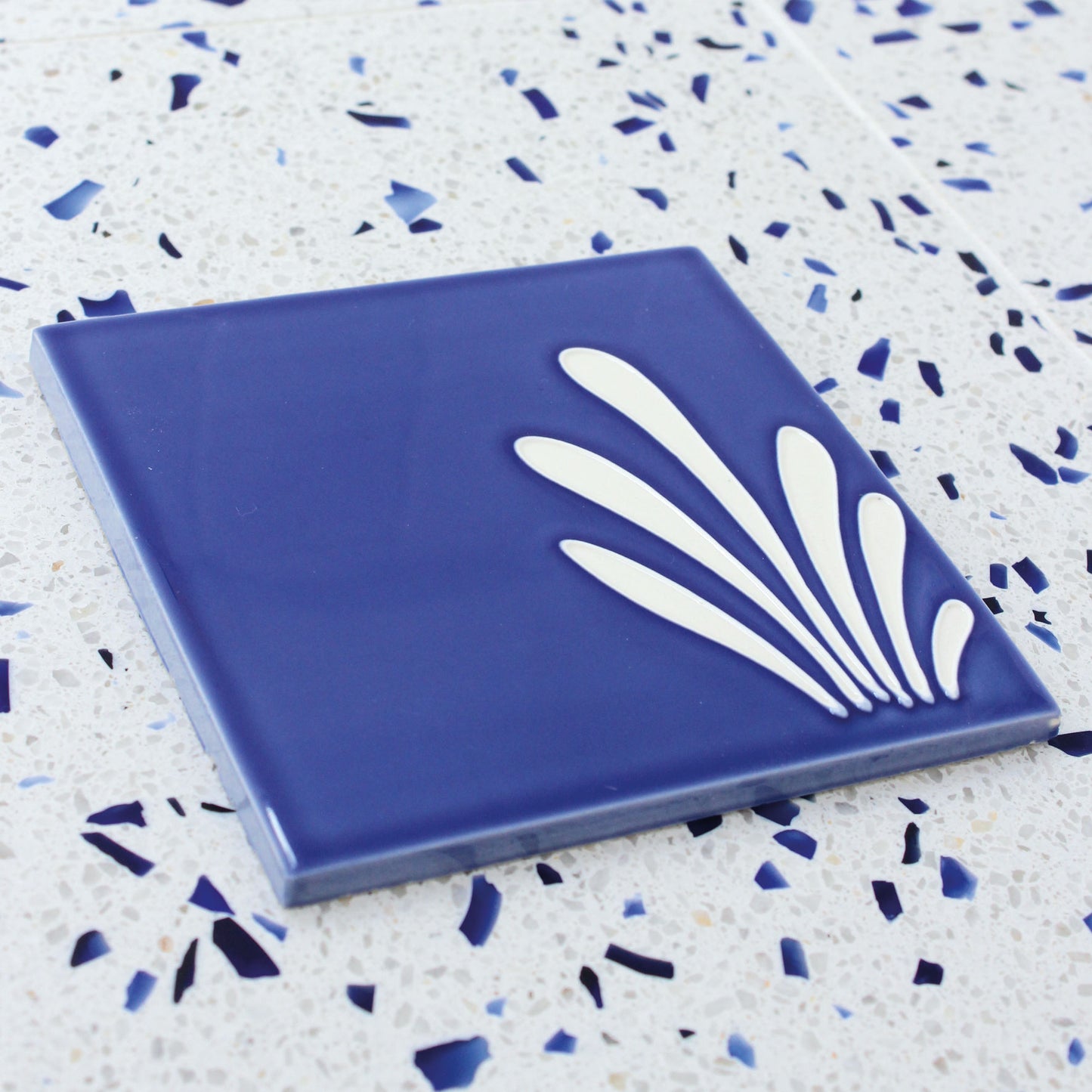 Spray hand painted tiles in Ocean