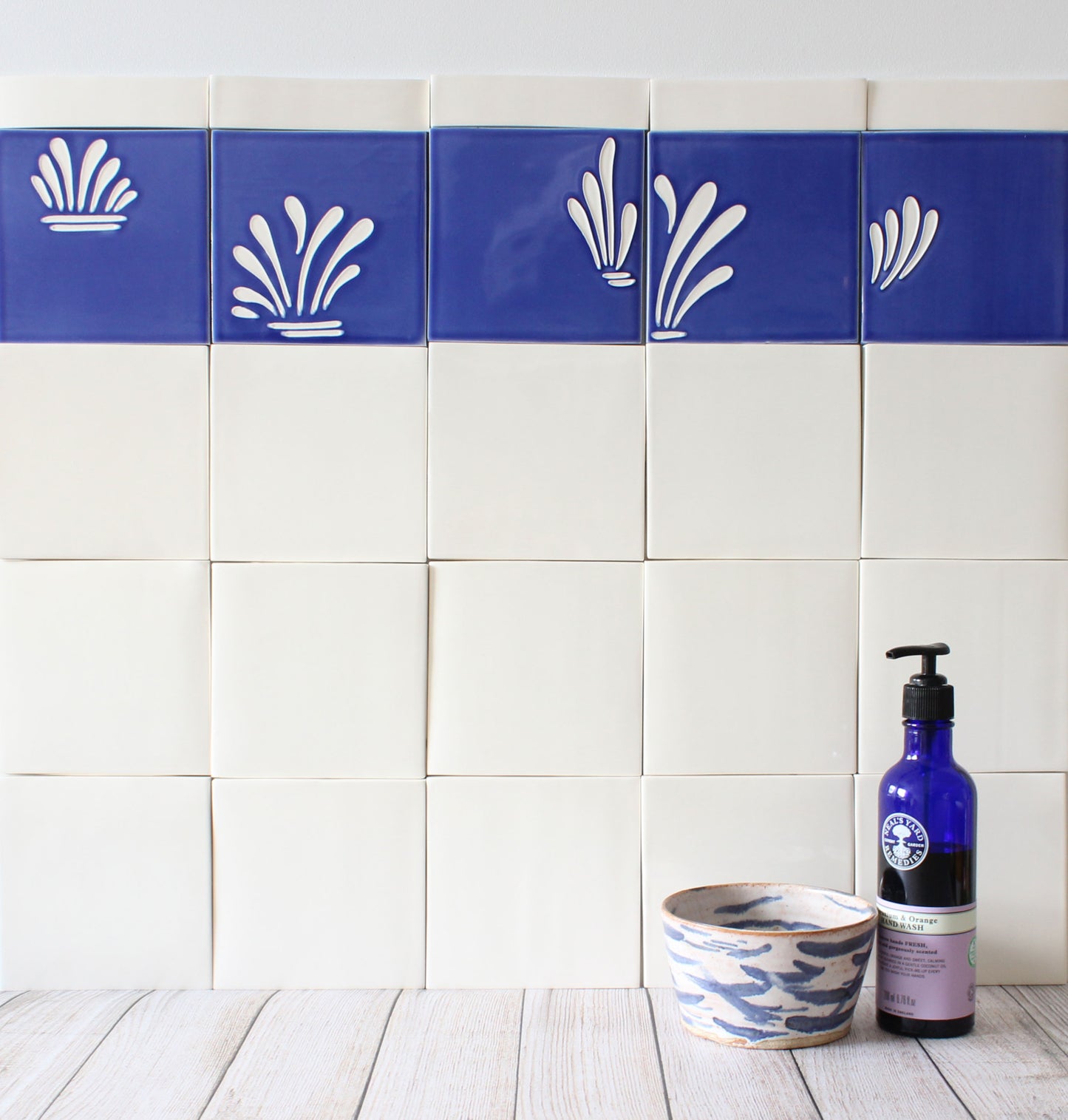 Spray hand painted tiles in Ocean